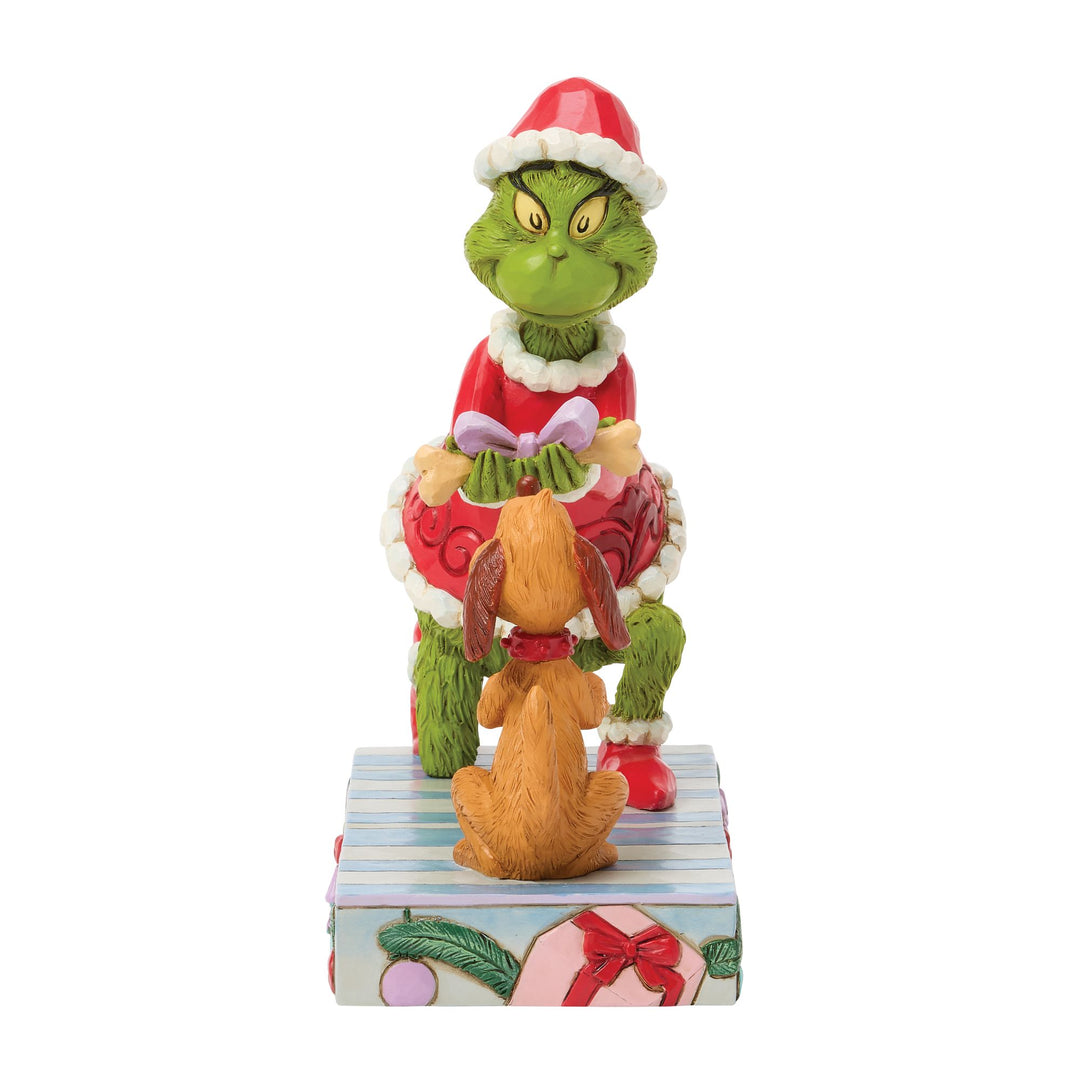 The Grinch Giving Max a Bone Figurine