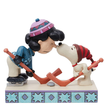 A Surprise Smooch (Snoopy and Lucy Playing Hockey Figurine) - Peanuts by Jim Shore - Enesco Gift Shop