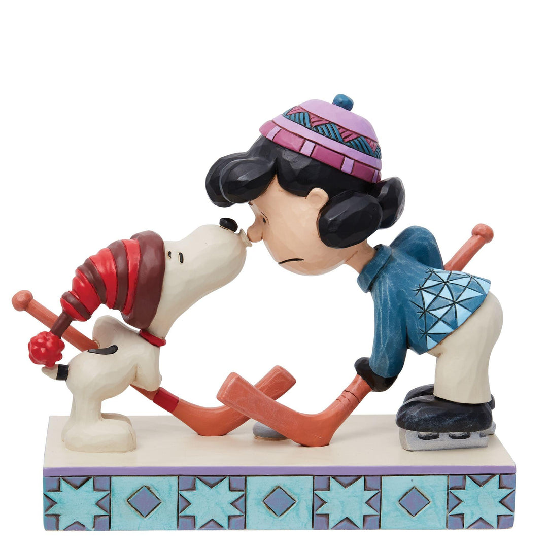 A Surprise Smooch (Snoopy and Lucy Playing Hockey Figurine) - Peanuts by Jim Shore - Enesco Gift Shop