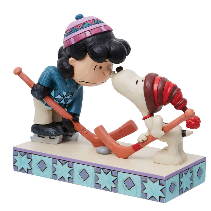 A Surprise Smooch (Snoopy and Lucy Playing Hockey Figurine) - Peanuts by Jim Shore - Enesco Gift Shop