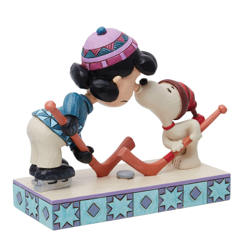 A Surprise Smooch (Snoopy and Lucy Playing Hockey Figurine) - Peanuts by Jim Shore - Enesco Gift Shop